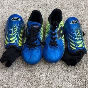 LOTTO Kids Blue and Yellow Soccer Cleats with Shin guards.